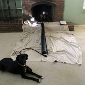 Chimney sweep equipment set up in front of a fireplace for Full Service Chimney in Overland Park, KS