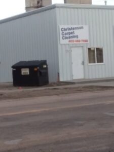 Exterior view of the Christenson Carpet Cleaning & Restoration building with its sign in Hastings, NE.