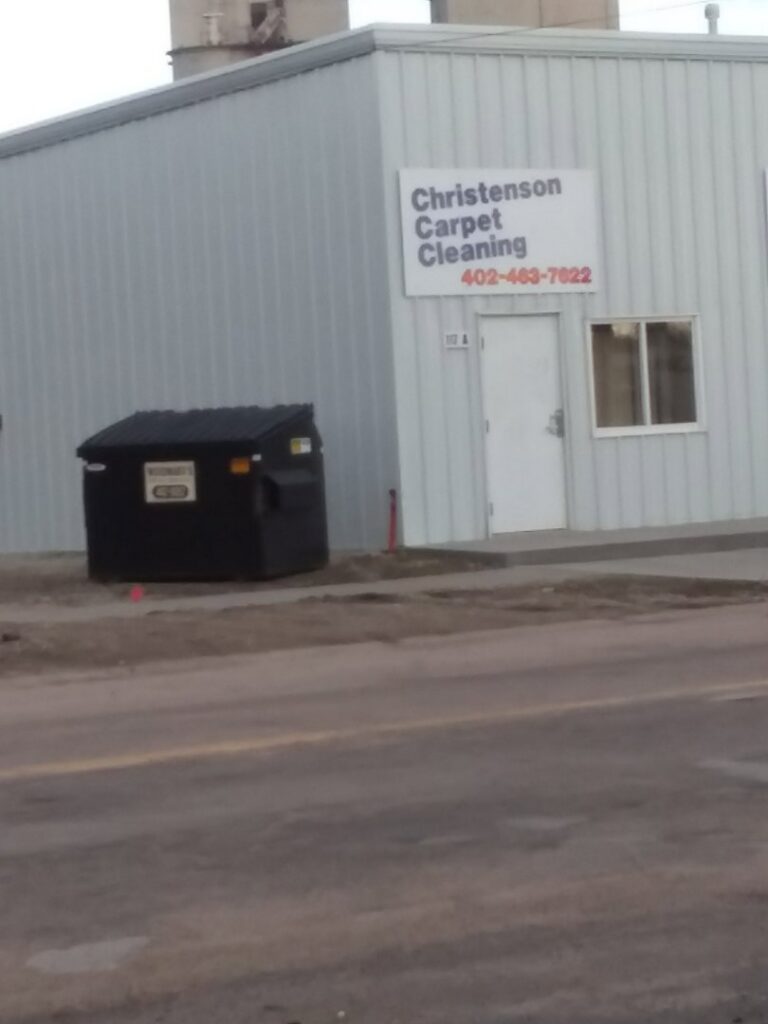 Exterior view of the Christenson Carpet Cleaning & Restoration building with its sign in Hastings, NE.
