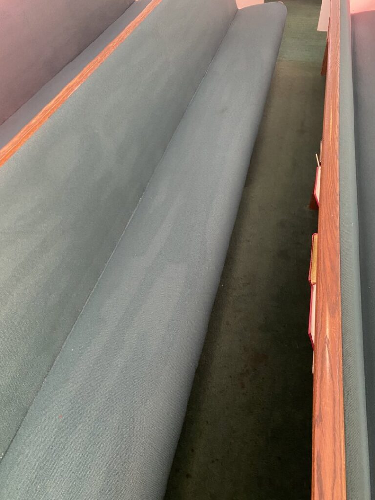 Cleaned church pews and green carpet by M3 Cleaning Solutions, LLC in Montgomery, AL.