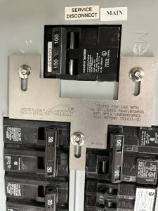 Close-up of a circuit breaker panel with an interlock kit installed by T.S.F Electric in Saco, ME.