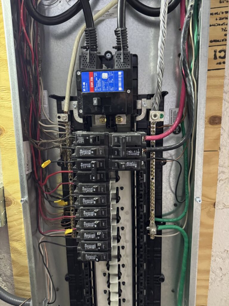 Detailed view of a circuit breaker panel with organized wiring, installed by York Electric of Westchester in Yonkers, NY.