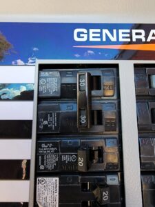 Close-up view of circuit breakers inside an electrical panel, serviced by CDB Electrical LLC in Tucson, AZ.