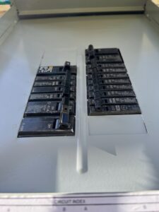 Close-up view of circuit breakers inside an electrical panel, maintained by Solution Electric in Houston, TX.