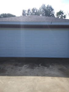 A classic white panel garage door installed for a home by Residential WorX LLC in Westlake, LA.