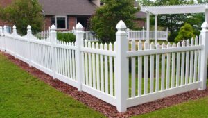 A classic white picket fence enhancing the curb appeal of a home by Freeman Fence in Atlanta, GA.
