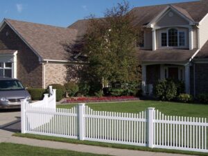 A classic white picket fence installed around a residential property by Longhorn Fencing Eastern Idaho in Pocatello, ID.