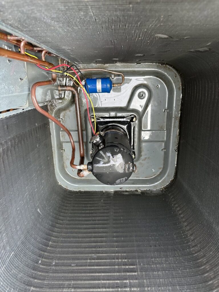 A clean air conditioning compressor unit after an HVAC service by Nacho Heating & Cooling Plus Co. in Crest Hill, IL