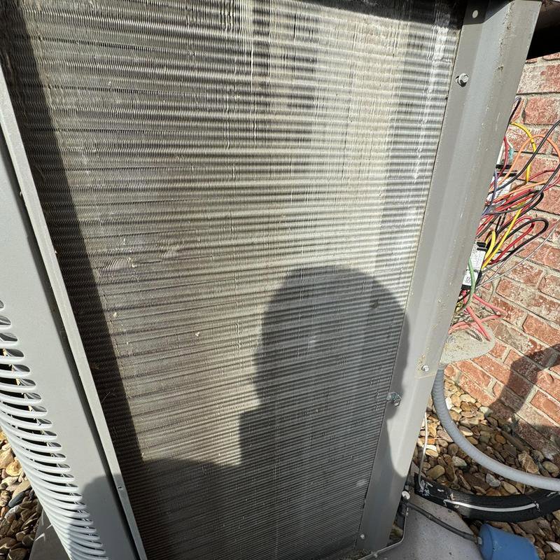 A close-up view of clean AC condenser fins, indicating proper maintenance by Hodges Heating & Cooling in Owensboro, KY.