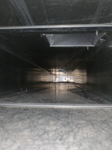 A view inside a thoroughly cleaned air duct interior after service by Air Duct Solutions in Waukee, IA.