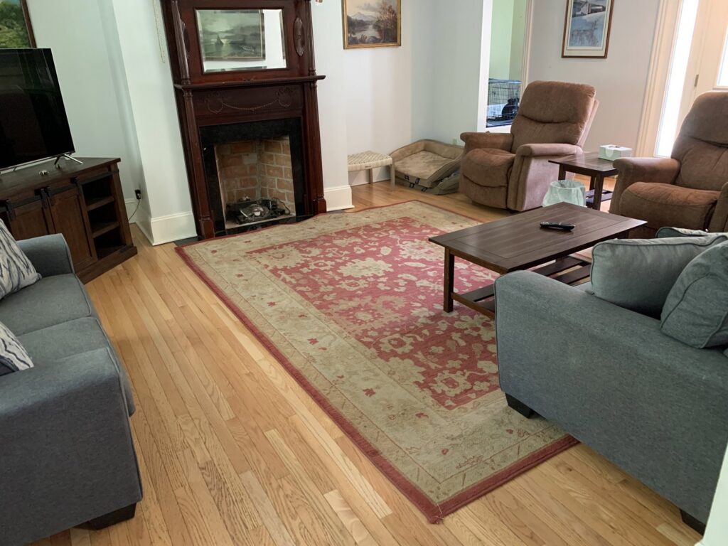 A clean area rug in a living room after professional cleaning by Cool Beans Cleaning Company in Sioux Falls, SD