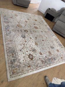 A clean, patterned area rug on a hardwood floor after service by Safe-Dry Carpet Cleaning of Clarksville, TN