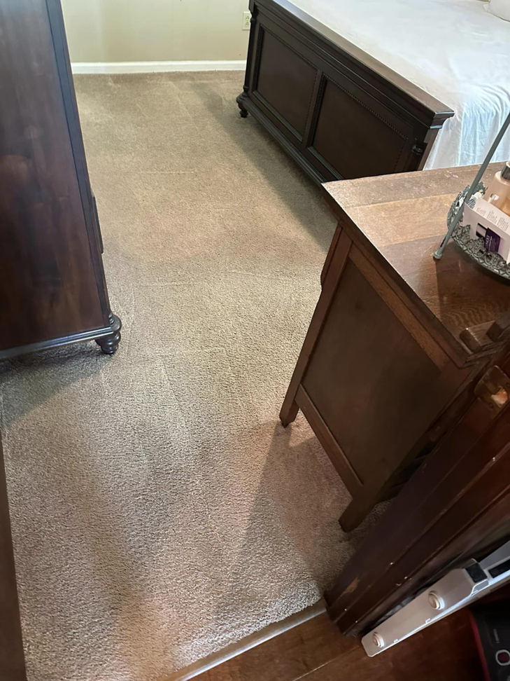 A clean bedroom carpet with fresh vacuum lines after professional cleaning by J & C Stain Masters in Tallahassee, FL.