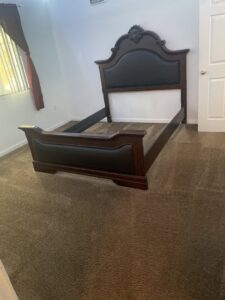 An empty bedroom with a clean, brown carpet after professional service by Healthy Homes Cleaning and Restoration LLC in Fort Lauderdale, FL.