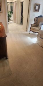 A clean, light-colored carpet with distinct vacuum lines in a bedroom, cleaned by Healthy Homes Cleaning and Restoration LLC in Fort Lauderdale, FL.