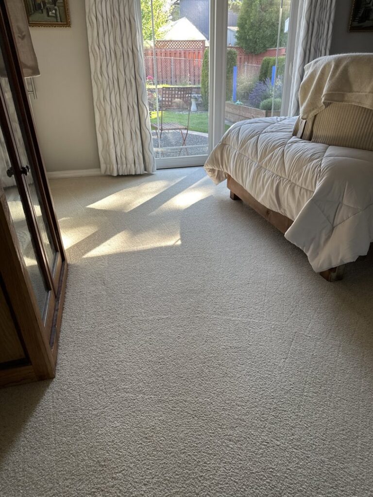 A bright and clean bedroom carpet after professional cleaning by Pacific Steam Carpet Cleaning in Gresham, OR.