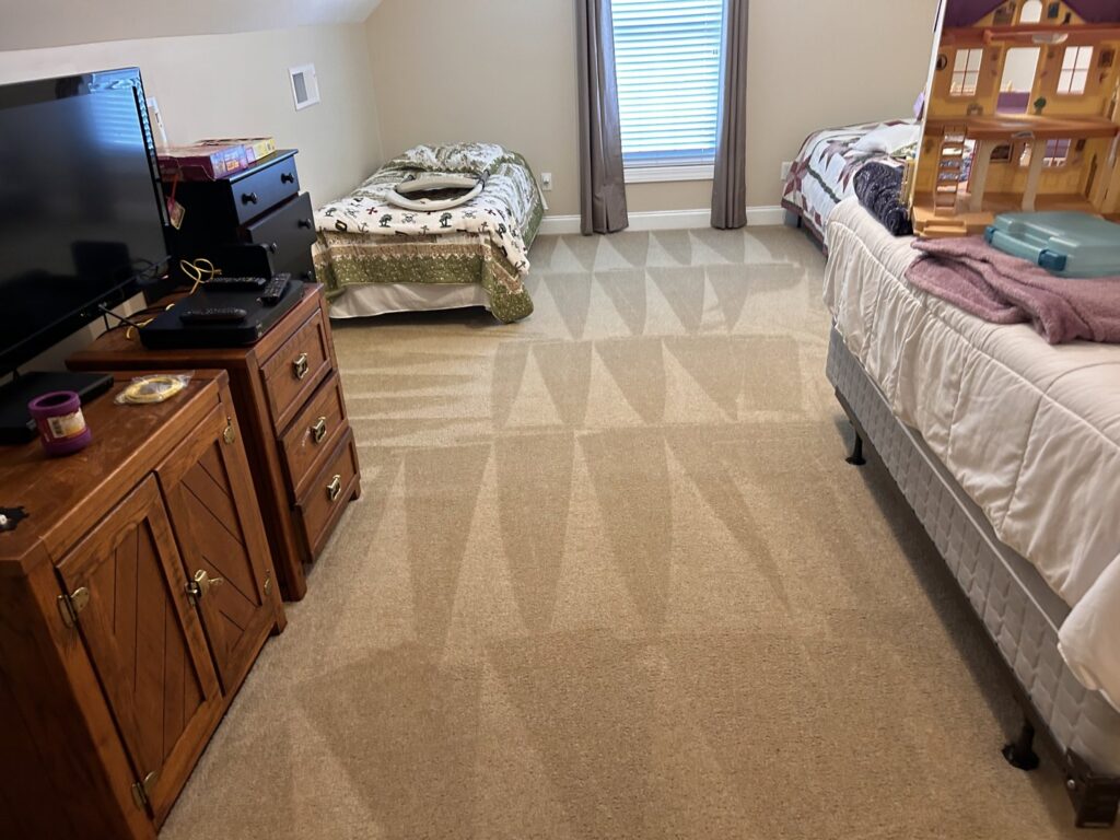 A clean beige carpet in a bedroom showing diagonal cleaning lines from Zerorez Columbia in Columbia, SC.