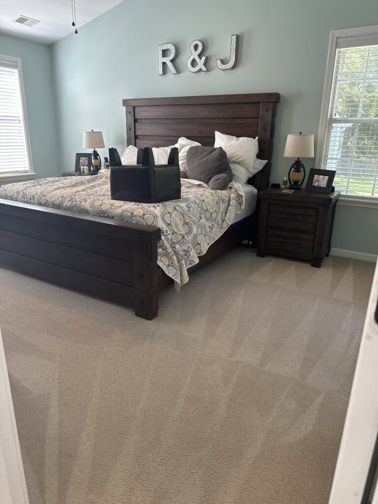 A clean beige bedroom carpet showing distinct cleaning lines from Zerorez Columbia in Columbia, SC.