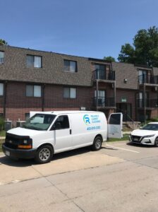 A clean carpet with distinct cleaning lines in a room with a sliding door to a balcony, by Reliable Carpet Cleaning LLC in Liverpool, NY.