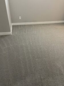 A freshly cleaned carpet in a bedroom after service by Arizona Steamers Carpet Care in Phoenix, AZ.
