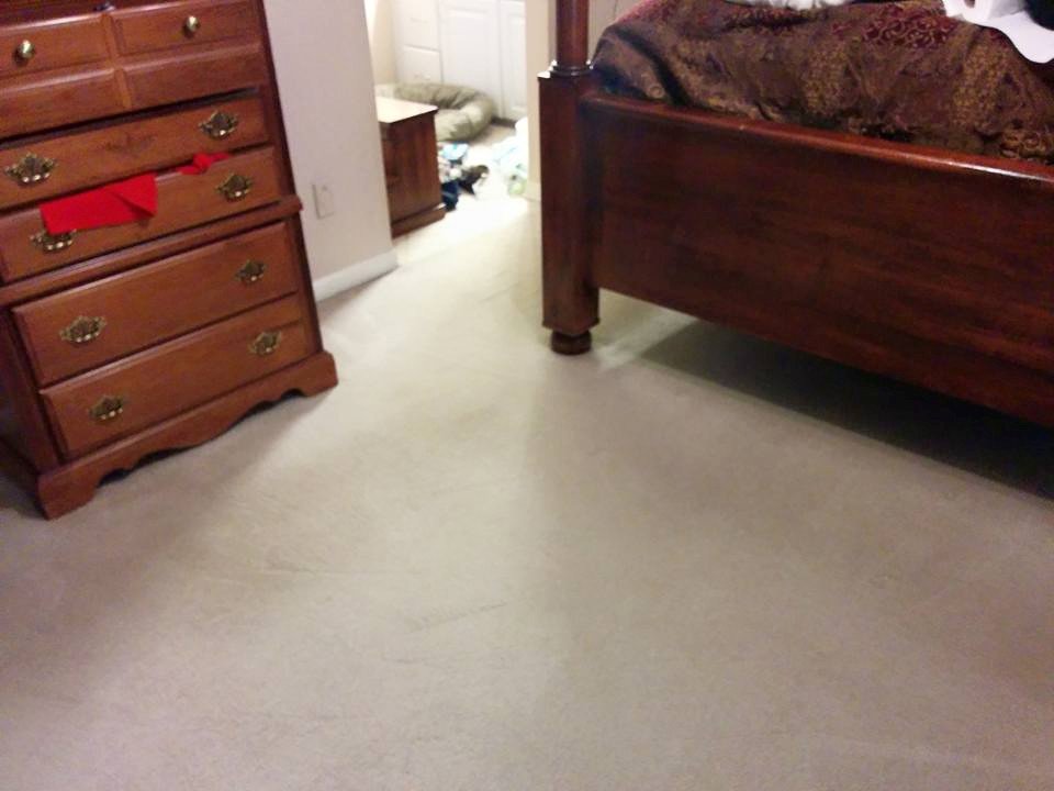 A clean, light-colored carpet in a bedroom after professional service by All Dimension Floor Care in Lenexa, KS.