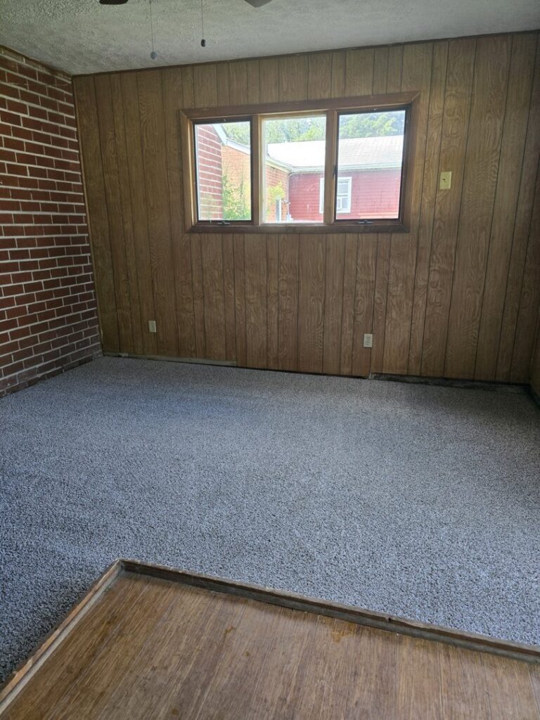 A clean, freshly serviced carpet in an empty room by PRIME CLEAN VA in Virginia Beach, VA.