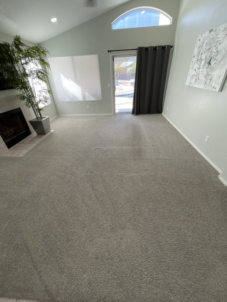 A freshly cleaned carpet in a living room after service by Arizona Steamers Carpet Care in Phoenix, AZ.