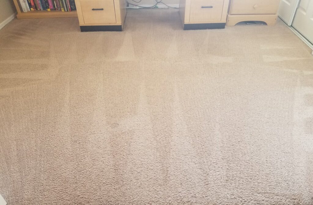 A clean carpet under a desk after professional cleaning by Integrity Cleaning Systems in Peoria, AZ