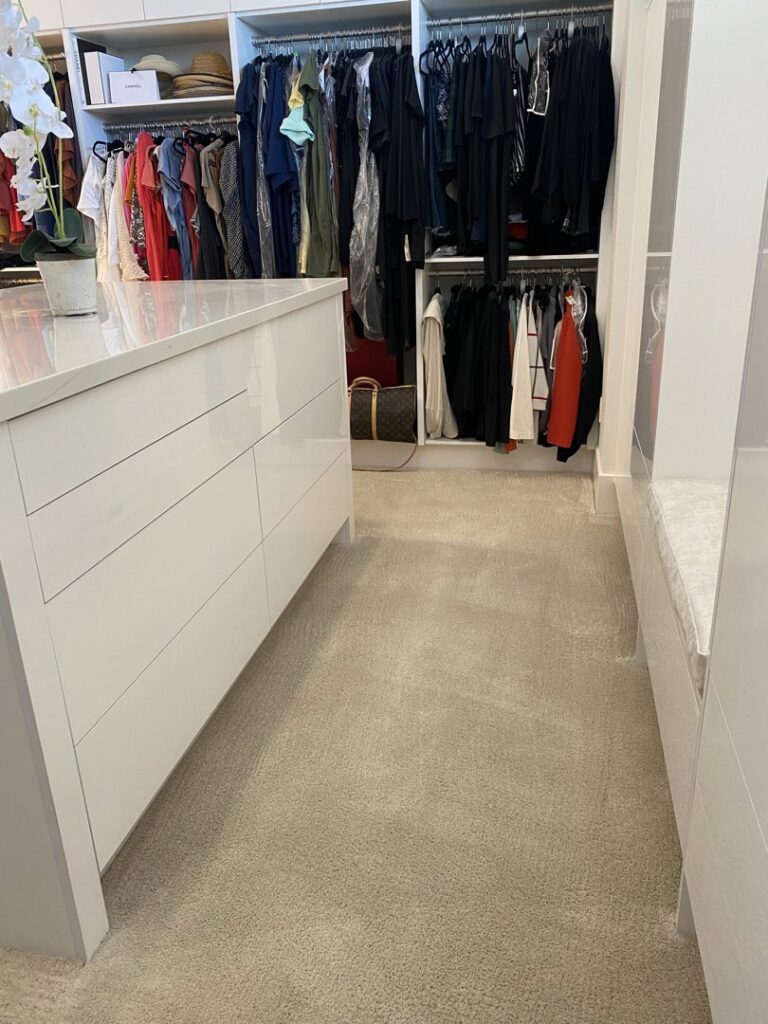 A clean, light-colored carpet in a spacious walk-in closet, demonstrating carpet cleaning services by Reno Kwik Dry Total Cleaning in Sparks, NV.