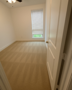 A room with clean carpet showing fresh cleaning lines after service by Stain Punishers Carpet Cleaning in Plano, TX.