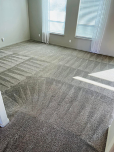 A clean carpet with visible vacuum lines in a bedroom, demonstrating the thorough service of C & C Carpet Cleaning in Spokane, WA.