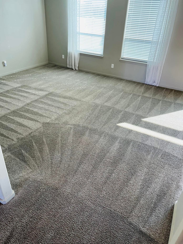 A clean carpet with visible vacuum lines in a bedroom, demonstrating the thorough service of C & C Carpet Cleaning in Spokane, WA.