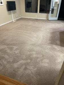 A clean carpet in a living room showing fresh vacuum lines after service by My Dad's Floor and Upholstery Cleaning in Sacramento, CA.
