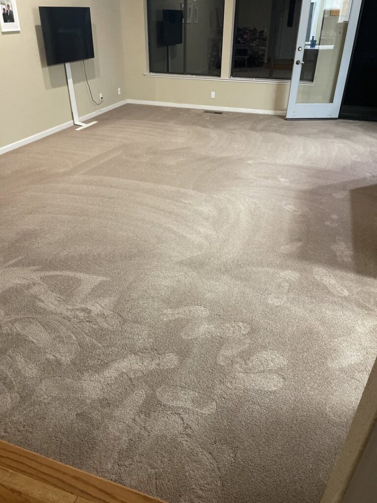 A clean carpet in a living room showing fresh vacuum lines after service by My Dad's Floor and Upholstery Cleaning in Sacramento, CA.