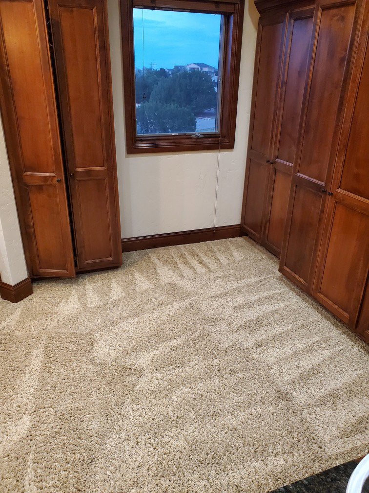 A room with clean carpet showing fresh vacuum lines after service by Pueblo's Best Carpet & Air Duct Cleaning in Pueblo West, CO.