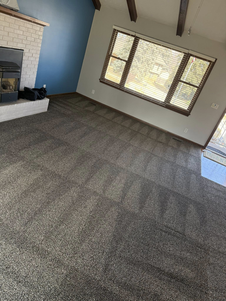 A clean carpet with fresh vacuum marks in a living area by Midwest Carpet Rescue in Omaha, NE.