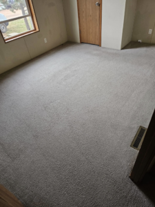 A clean carpeted bedroom after professional cleaning service by Peterson's Carpet & Air Duct Cleaning in Dickinson, ND.