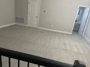 A spacious, clean carpeted room, likely after professional installation or cleaning by Mr. Carpet Cleaning Orlando, FL.