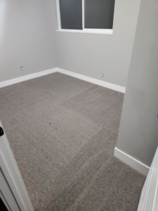 A freshly cleaned or newly installed carpet in a residential room by Clean Freaks in Ogden, UT.