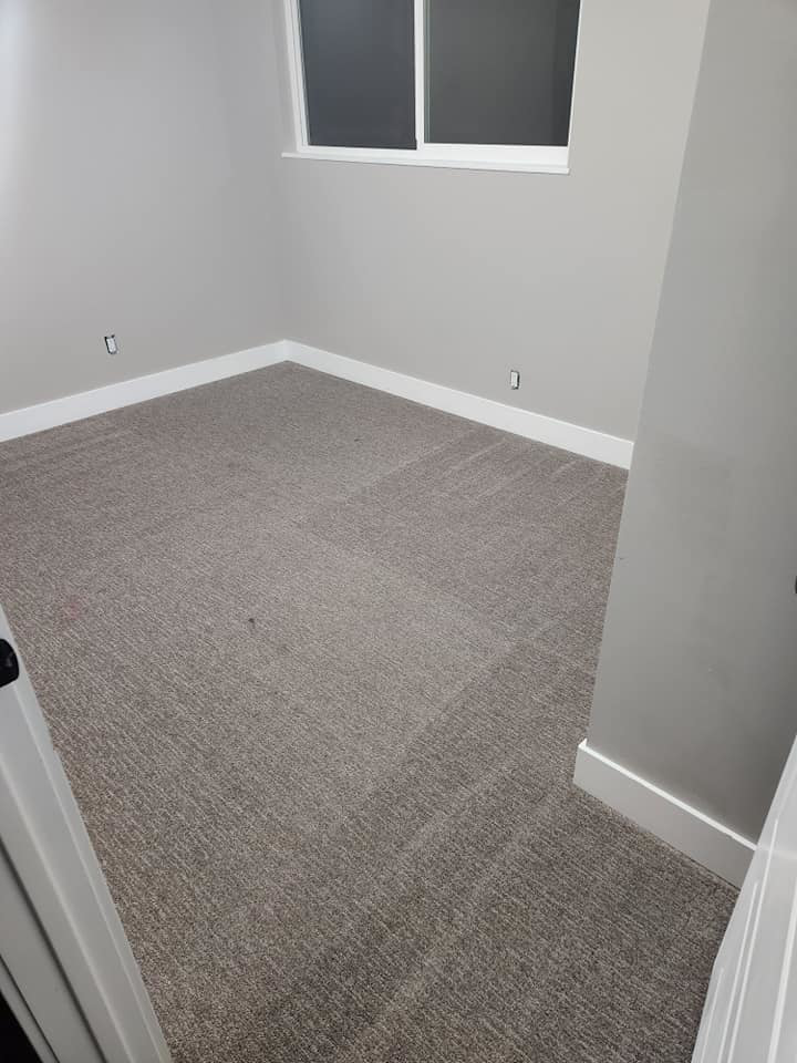 A freshly cleaned or newly installed carpet in a residential room by Clean Freaks in Ogden, UT.