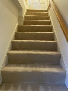 A freshly cleaned carpeted staircase by Express Cleaning in Lowell, MA