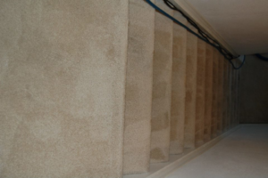 A clean, light-colored carpeted staircase, showcasing the quality work of Mid State Contract Cleaners in Nashville, TN.