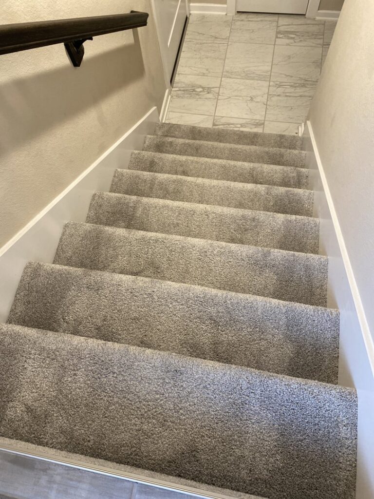 Freshly cleaned carpeted stairs after a professional service by Carpet Kingz in Houston, TX