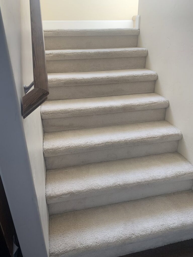 Freshly cleaned carpeted stairs after service by Clean-Master in Coeur d'Alene, ID.