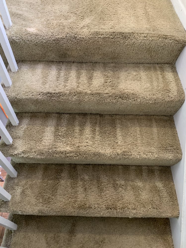 Freshly cleaned carpeted stairs showing distinct cleaning lines by GTS future cleaning services in Los Angeles, CA