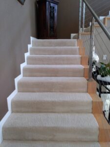 Freshly cleaned, light-colored carpeted stairs in a home by My Dad's Floor and Upholstery Cleaning in Sacramento, CA.