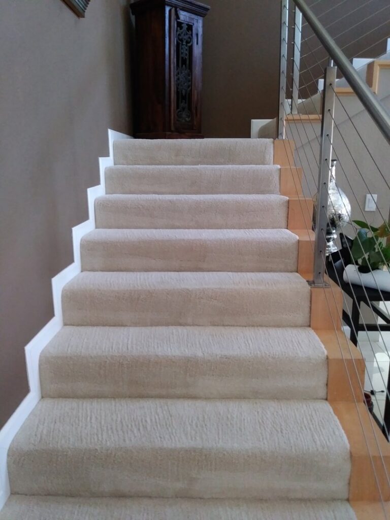 Freshly cleaned, light-colored carpeted stairs in a home by My Dad's Floor and Upholstery Cleaning in Sacramento, CA.