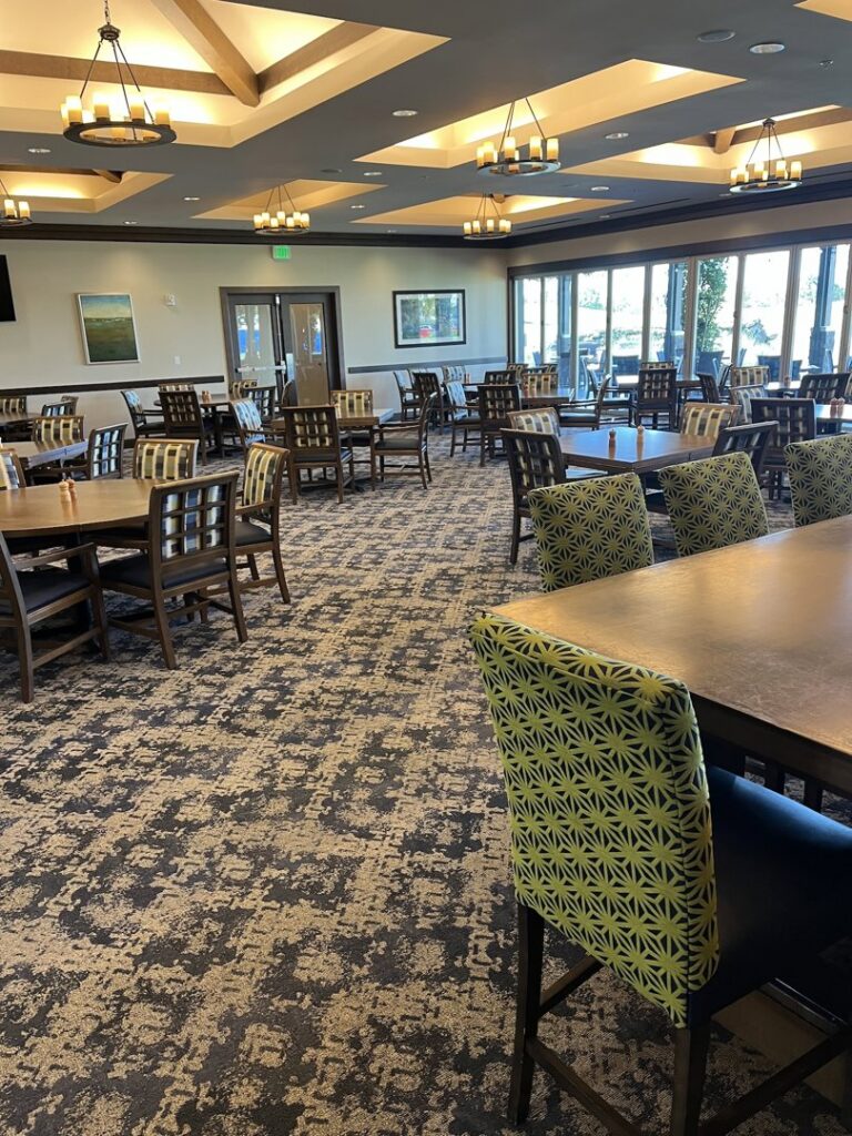A clean, patterned commercial carpet in a dining area, maintained by The Best Carpet & Tile Cleaners in Alva, FL.