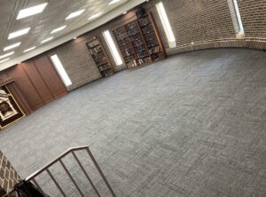 A large, clean commercial carpet in a library or office setting, maintained by Carpet Cleaners Plus in Chicago, IL.