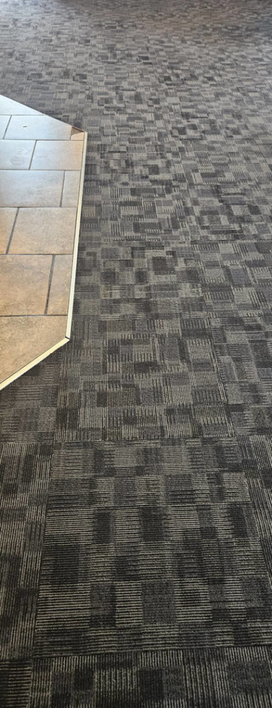 Clean commercial patterned carpet after service by American Carpet Care, Inc. in Watertown, SD.
